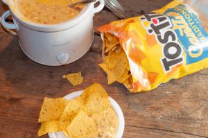 Crock Pot Chili Con Queso Dip with just three ingredients is always a crowd pleaser.
