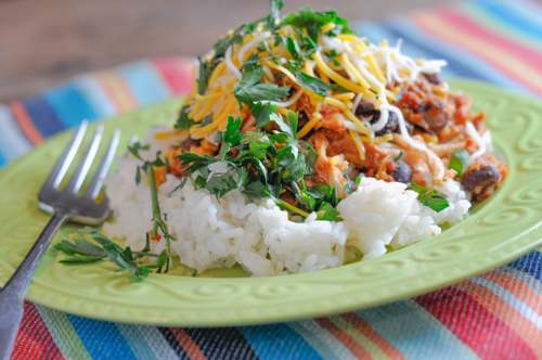 These Chicken Taco Bowls are a super easy crock pot recipe that pleases everyone on busy nights!