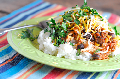 These Chicken Taco Bowls are a super easy crock pot recipe that pleases everyone on busy nights!