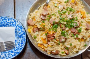 Cheesy Smoked Sausage Bowties-pasta, cheese, bell peppers, smoked sausage - a one skillet meal to feed the family!