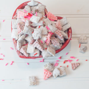 A million versions of Puppy Chow and this Cherry Chip Puppy Chow is my favorite, made with white chocolate, cherry chip cake mix and sugar wafers!