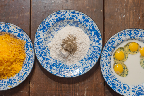 These Cheesy Chicken Tenders are a go to comfort food here! Moist with a cheesy crunchy cornflake coating!