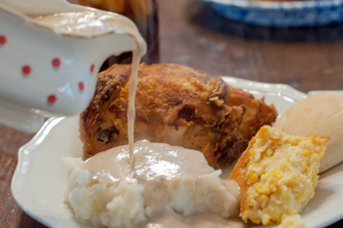 Fried Chicken and Skillet Gravy from Farmwife Feeds is just like Grandma's Sunday Dinner #recipe #castiron #chicken #friedchicken