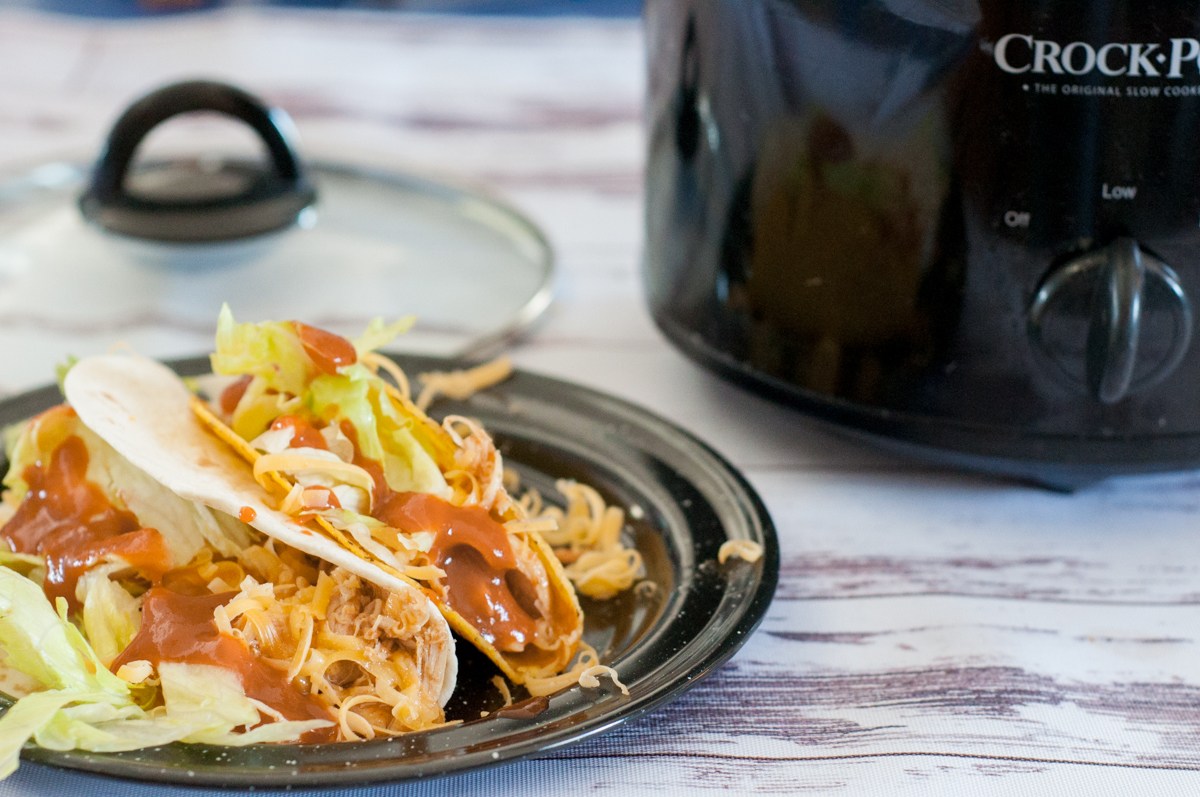 Crock Pot Chicken Tacos from Farmwife Feeds is super easy meal when you forgot to plan or as part of the plan! #chicken #crockpot #mexican