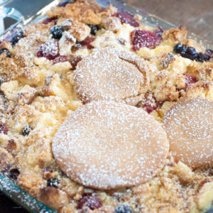 Mickey's Breakfast Lasagna from Farmwife Feeds, a bread pudding made with pancakes and pound cake, fresh berries, sweet custard and pastry cream.