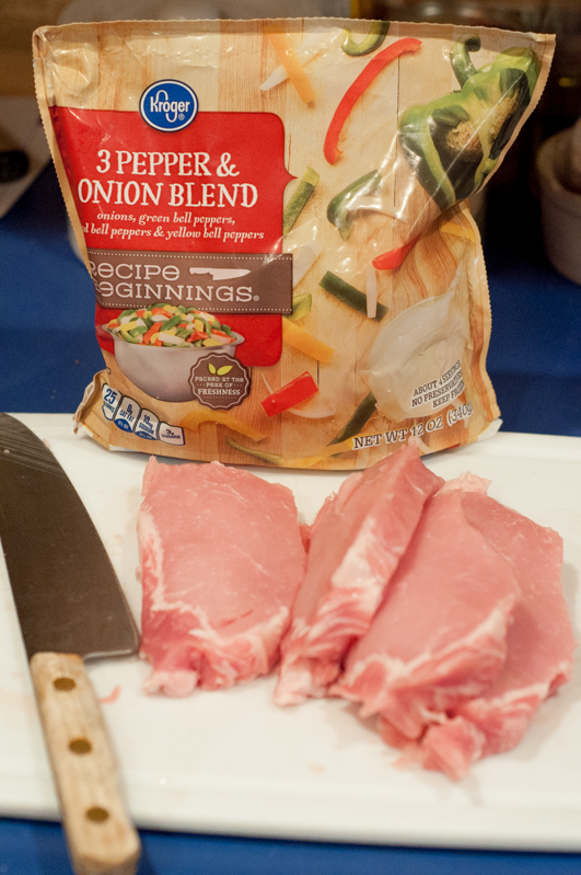 Easy Skillet Peppers, Onions and Pork Chops from Farmwife Feeds is an easy meal using frozen pepper and onion mix and boneless pork chops. #pork #recipe #porkchops