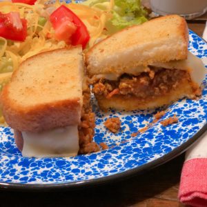 Super Easy Italian Sloppy Joes from Farmwife Feeds served on your favorite ready to go garlic bread and a side salad is a go to meal for busy days. #sloppyjoes #Italian #recipe #sandwich