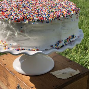 Everyday Wedding Cake from Farmwife Feeds is an easy homemade add to box mix cake that tastes bakery made. #weddingcake #cake #sprinkles #boxmix