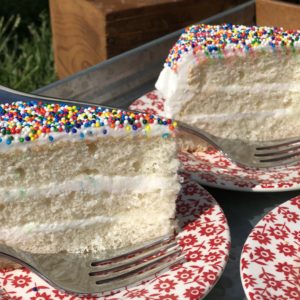 Everyday Wedding Cake from Farmwife Feeds is an easy homemade add to box mix cake that tastes bakery made. #weddingcake #cake #sprinkles #boxmix