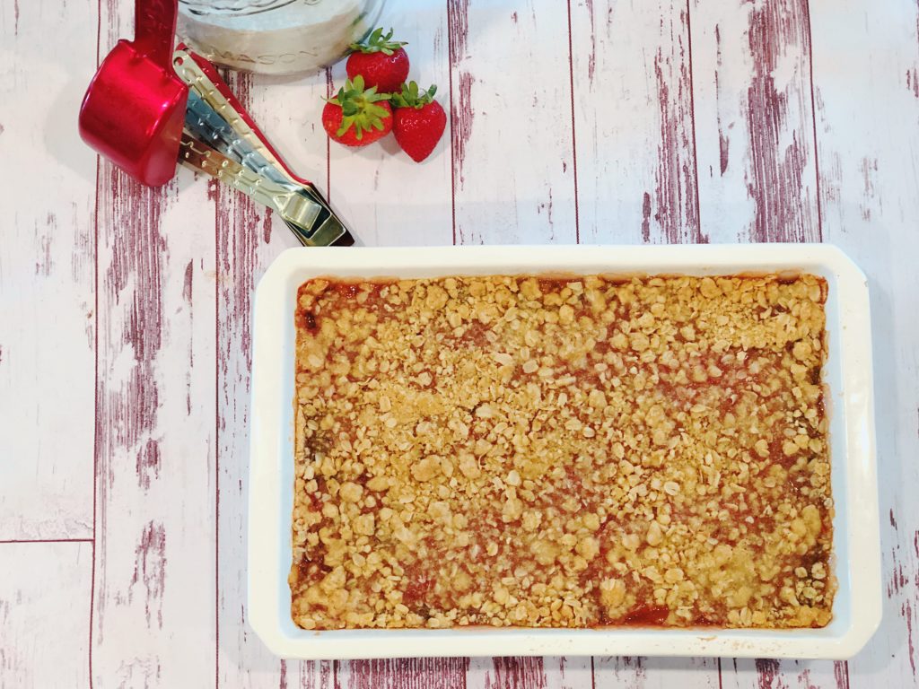 Grandma's Rhubarb Bars from Farmwife Feeds with a touch of strawberry jam is a great dessert for pitch-ins and get togethers. #rhubarb #recipe #bardessert