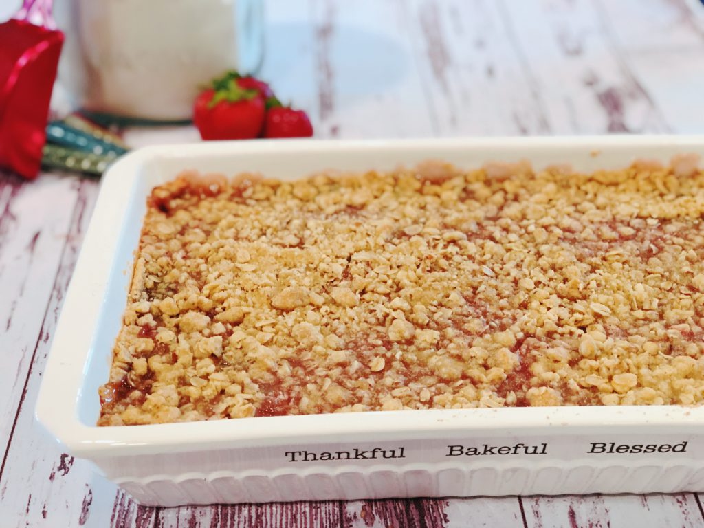 Grandma's Rhubarb Bars from Farmwife Feeds with a touch of strawberry jam is a great dessert for pitch-ins and get togethers. #rhubarb #recipe #bardessert