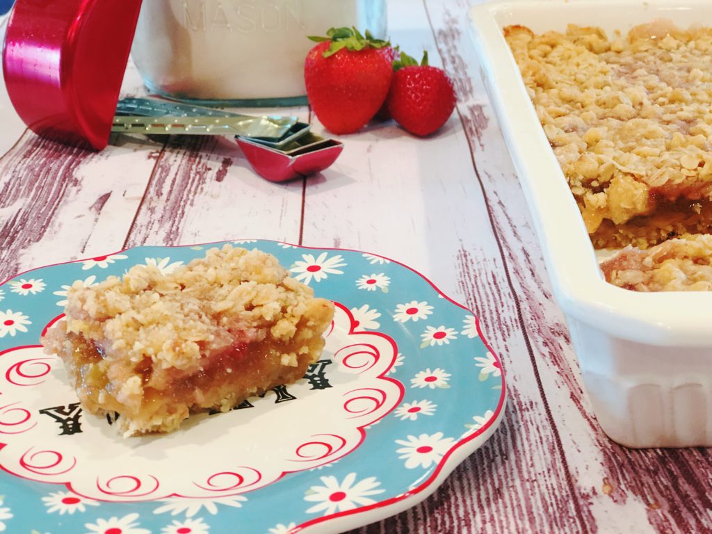 Grandma's Rhubarb Bars from Farmwife Feeds with a touch of strawberry jam is a great dessert for pitch-ins and get togethers. #rhubarb #recipe #bardessert