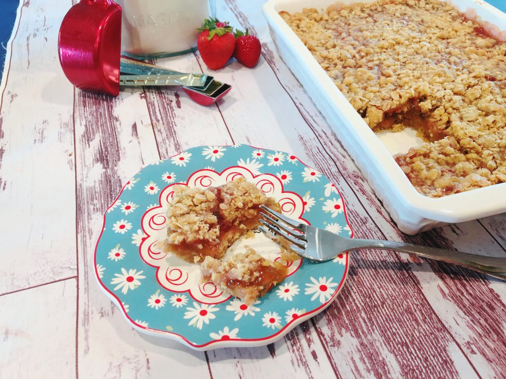 Grandma's Rhubarb Bars from Farmwife Feeds with a touch of strawberry jam is a great dessert for pitch-ins and get togethers. #rhubarb #recipe #bardessert