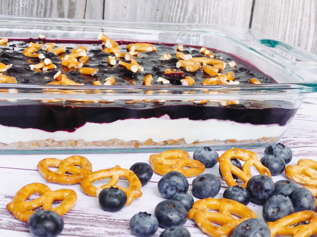 Blueberry Pretzel Salad from Farmwife Feeds a delicious spin on a classic, this version is made without Jello and uses fresh blueberries. #salad #creamcheese #recipe #blueberry #blueberries