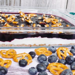 Blueberry Pretzel Salad from Farmwife Feeds a delicious spin on a classic, this version is made without Jello and uses fresh blueberries. #salad #creamcheese #recipe #blueberry #blueberries