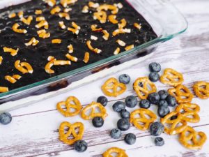 Blueberry Pretzel Salad from Farmwife Feeds a delicious spin on a classic, this version is made without Jello and uses fresh blueberries. #salad #creamcheese #recipe #blueberry #blueberries