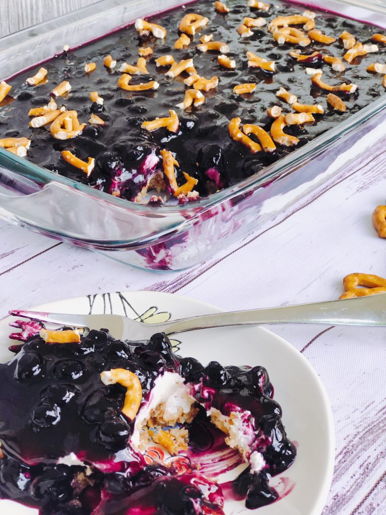 Blueberry Pretzel Salad from Farmwife Feeds a delicious spin on a classic, this version is made without Jello and uses fresh blueberries. #salad #creamcheese #recipe #blueberry #blueberries