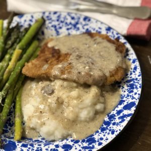 Pork Schnitzel with Dill Sauce is a great way to take pork tenderloins to the next level with an easy recipe. #pork #castiron #schnitzel