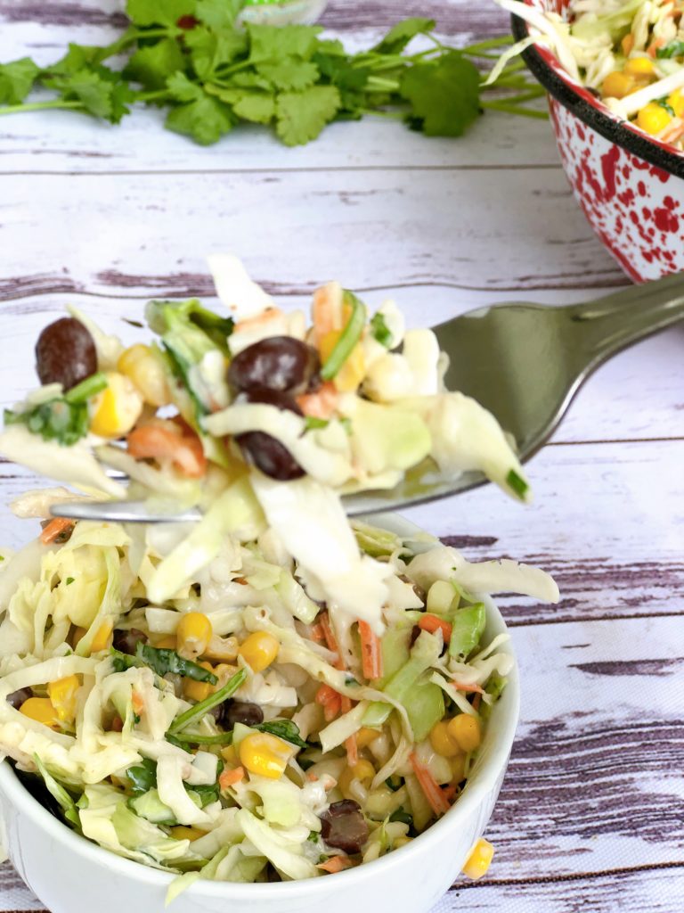 Cilantro Cole Slaw from Farmwife Feeds, a fresh easy twist on traditional slaw that's easy to throw together. #recipe #slaw #cilantro