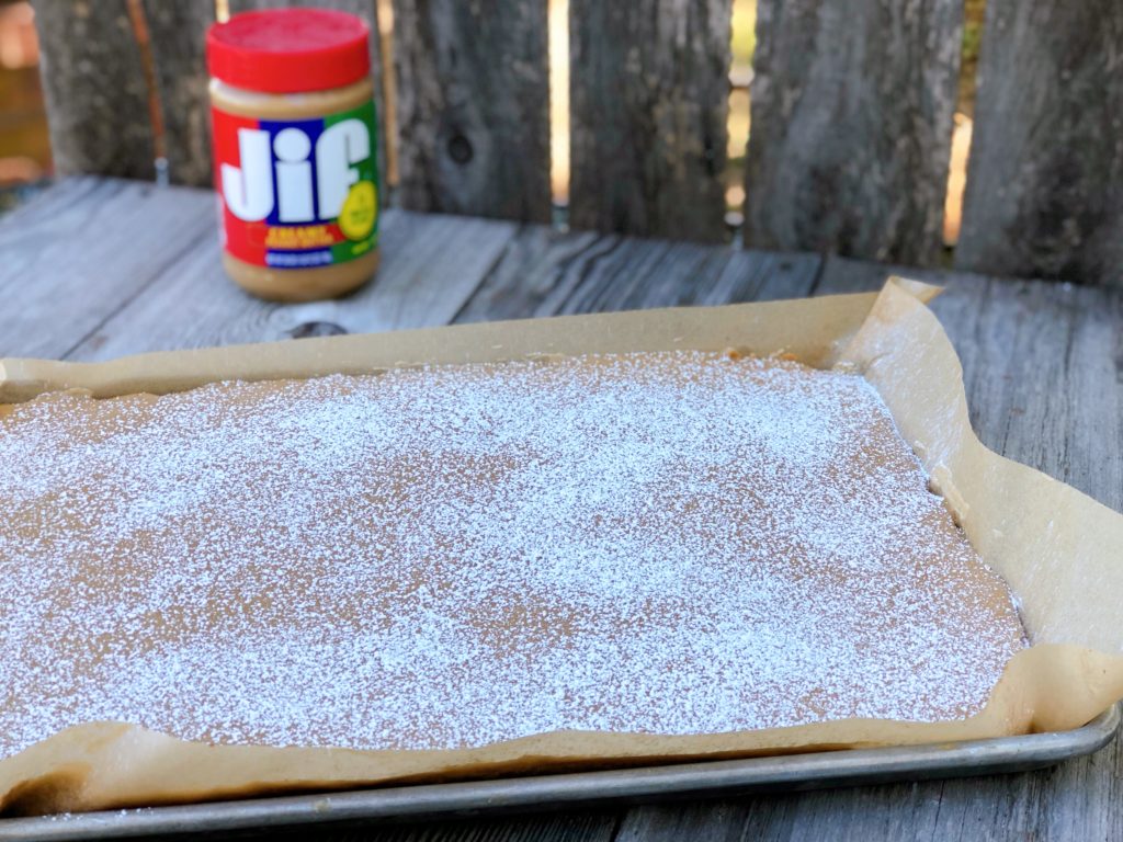 Peanut Butter Sheet Cake from Farmwife Feeds is a homemade cake and icing that will feed a crowd. #peanutbutter #cake #homemade