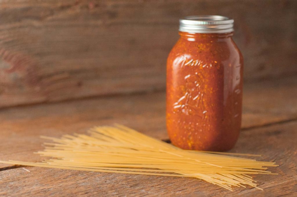 Super Meaty Spaghetti Sauce from Farmwife Feeds, ground beef and sausage make a big batch of spaghetti sauce that makes a great freezer meal. #spaghetti #tomatosauce #groundbeef #sausage