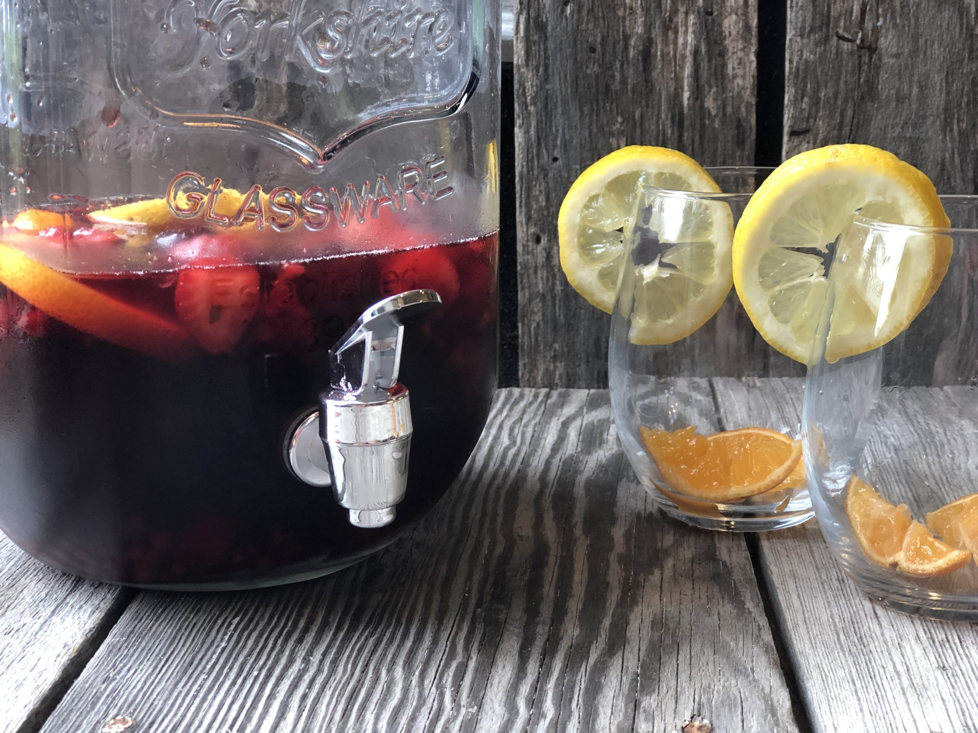 Super Simple Sangria from Farmwife Feeds is the easiest cocktail for a crowd or to enjoy by yourself watching the world go by. #sangria #redwine #fruit #wine