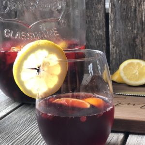 Super Simple Sangria from Farmwife Feeds is the easiest cocktail for a crowd or to enjoy by yourself watching the world go by. #sangria #redwine #fruit #wine