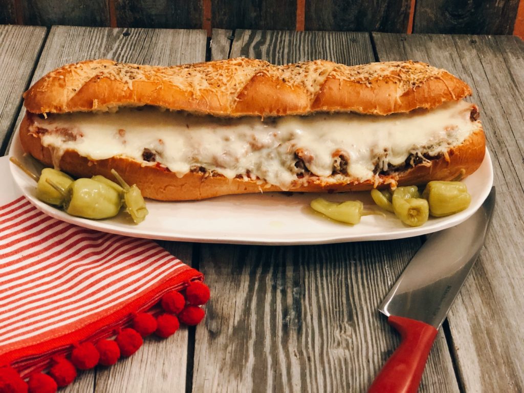 Easy Stromboli Sandwich from Farmwife Feeds, a family size sandwich that is simple to make and customize anyway your family likes. #recipe #grinder #sandwich