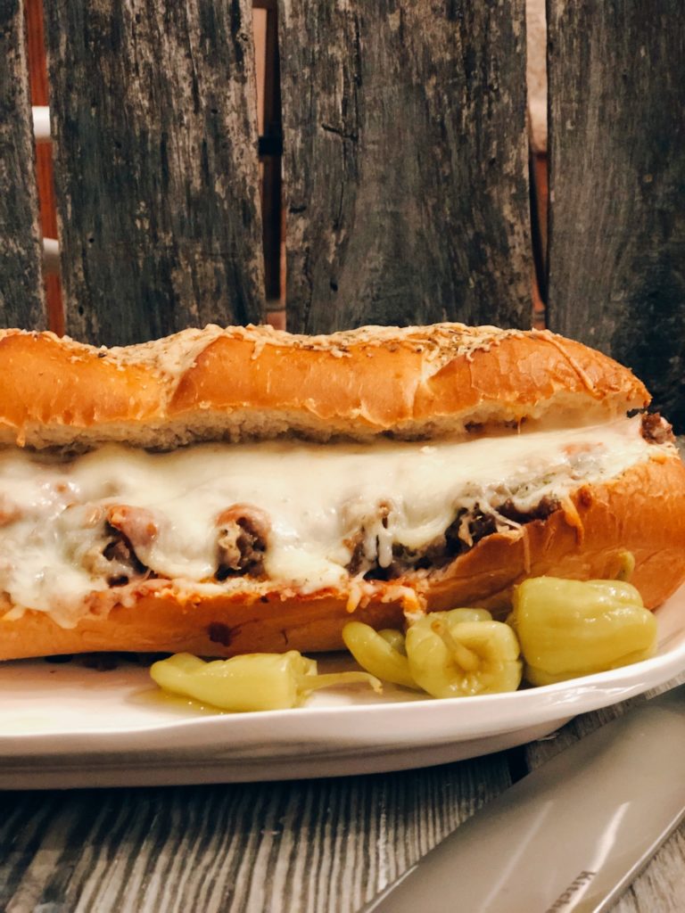 Easy Stromboli Sandwich from Farmwife Feeds, a family size sandwich that is simple to make and customize anyway your family likes. #recipe #grinder #sandwich