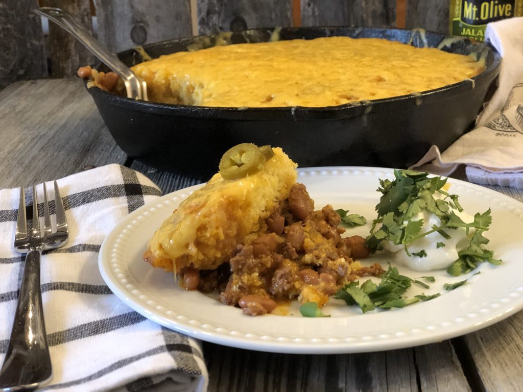 Ranch Beans, Beef and Cornbread Casserole from Farmwife Feeds is a one pan meal full of ground beef, seasoned beans and as much jalapeno kick as you want! #casserole #onepanmeal #groundbeef #castironskillet