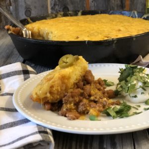 Ranch Beans, Beef and Cornbread Casserole from Farmwife Feeds is a one pan meal full of ground beef, seasoned beans and as much jalapeno kick as you want! #casserole #onepanmeal #groundbeef #castironskillet