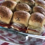 Hawaiian Pizza Sliders from Farmwife Feeds are a pizza take on slider sandwiches, easy to make and feed a crowd. #sliders #sandwiches #pizza