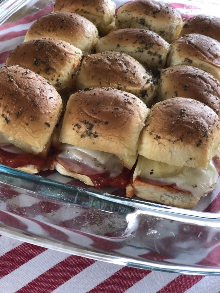 Hawaiian Pizza Sliders from Farmwife Feeds are a pizza take on slider sandwiches, easy to make and feed a crowd. #sliders #sandwiches #pizza