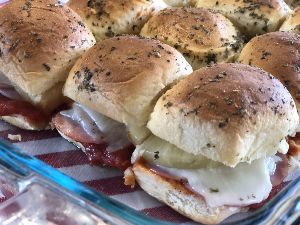 Hawaiian Pizza Sliders from Farmwife Feeds are a pizza take on slider sandwiches, easy to make and feed a crowd. #sliders #sandwiches #pizza