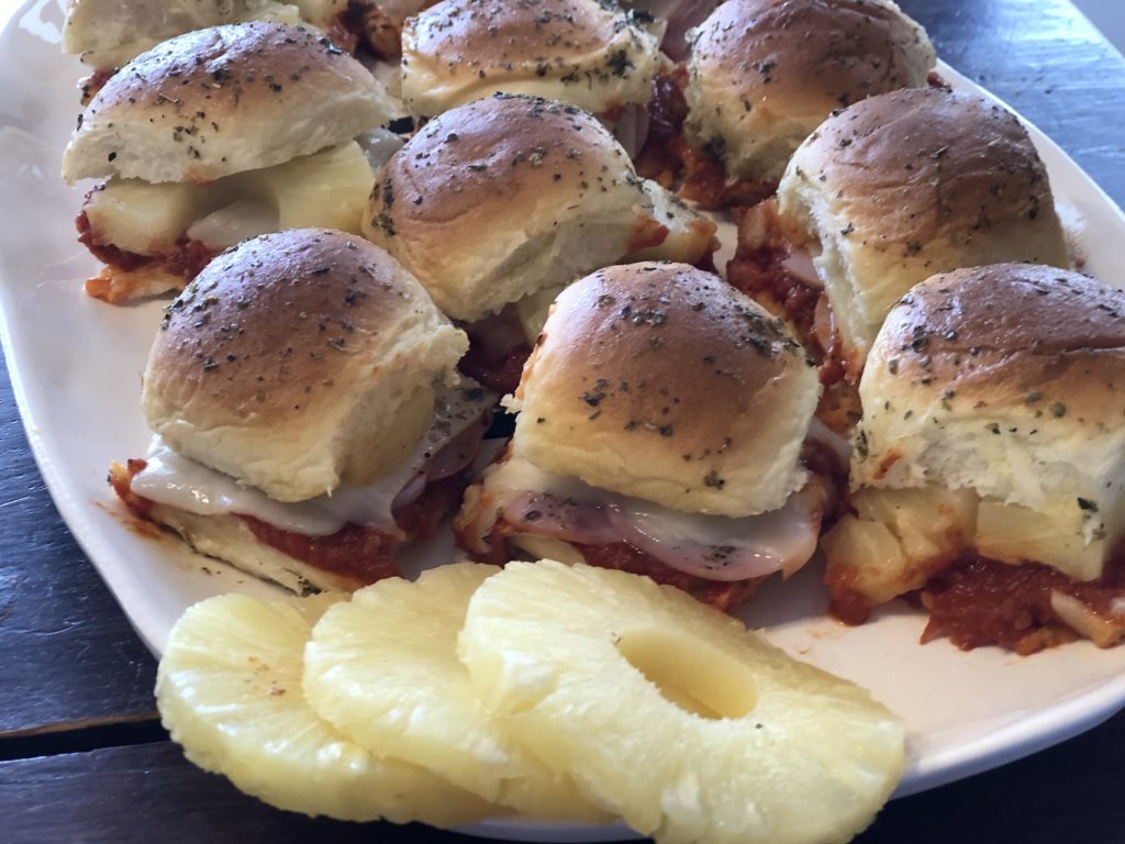 Hawaiian Pizza Sliders from Farmwife Feeds are a pizza take on slider sandwiches, easy to make and feed a crowd. #sliders #sandwiches #pizza