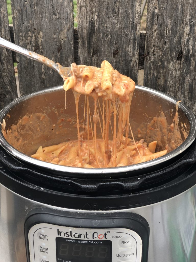 Instant Pot Beef Ziti from Farmwife Feeds is a cheesy hearty one pot meal ready for the table in less than 30 minutes. #instantpot #beef #pasta #recipe