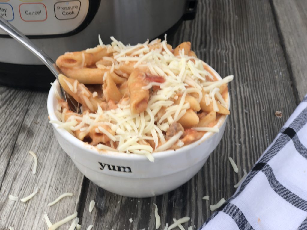 Instant Pot Beef Ziti from Farmwife Feeds is a cheesy hearty one pot meal ready for the table in less than 30 minutes. #instantpot #beef #pasta #recipe