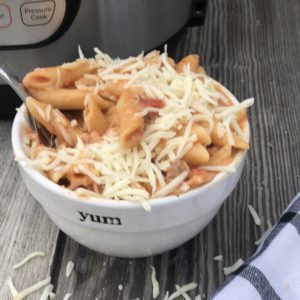 Instant Pot Beef Ziti from Farmwife Feeds is a cheesy hearty one pot meal ready for the table in less than 30 minutes. #instantpot #beef #pasta #recipe