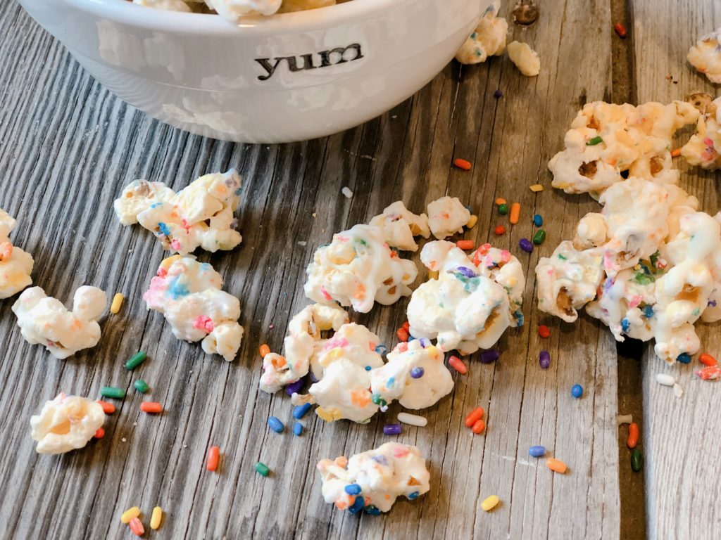 Marshmallow Funfetti Popcorn from Farmwife Feeds is a salty, sweet, chewy snack full of sprinkles, great for snacks or parties. #popcorn #sprinkles #marshmallow #treat