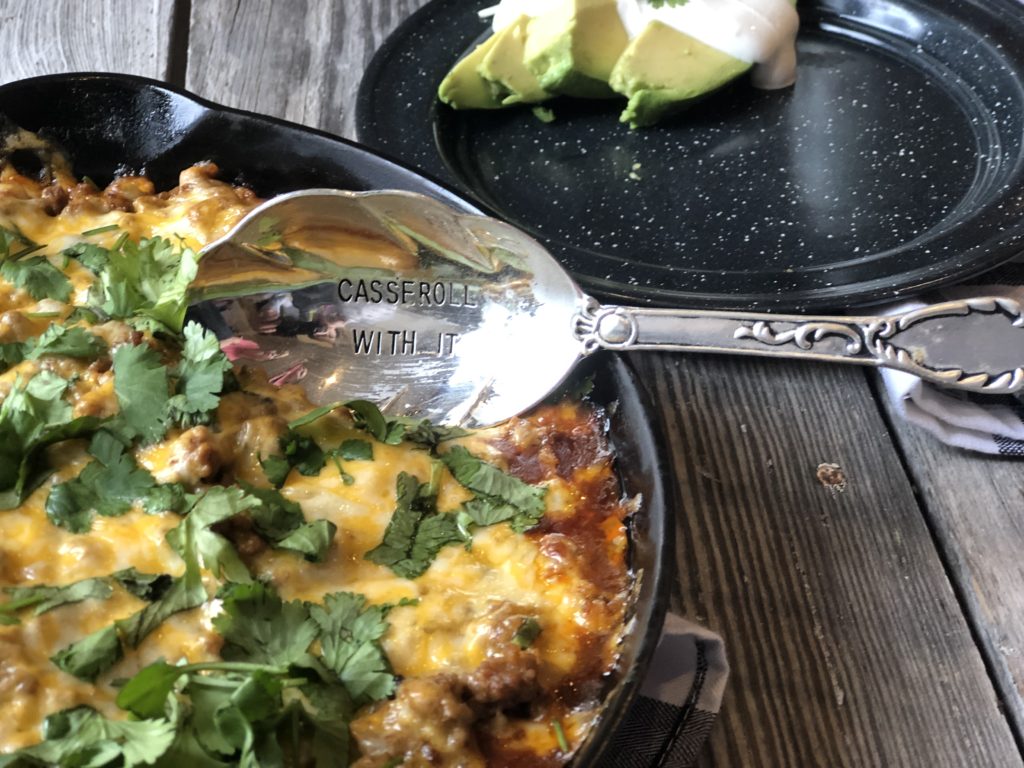 Tamale Pie from Farmwife Feeds made with easy homemade cornbread base, hamburger, enchilada sauce covered in cheese. #cornbread #beef #enchilada