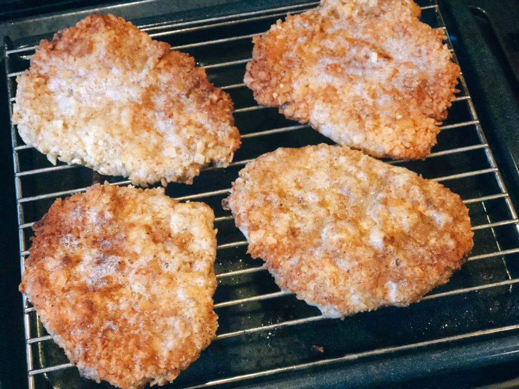 Breaded Pork Tenderloin from Farmwife Feeds is a crispy juicy classic sandwich with a cracker breading. #pork #sandwich #tenderloin