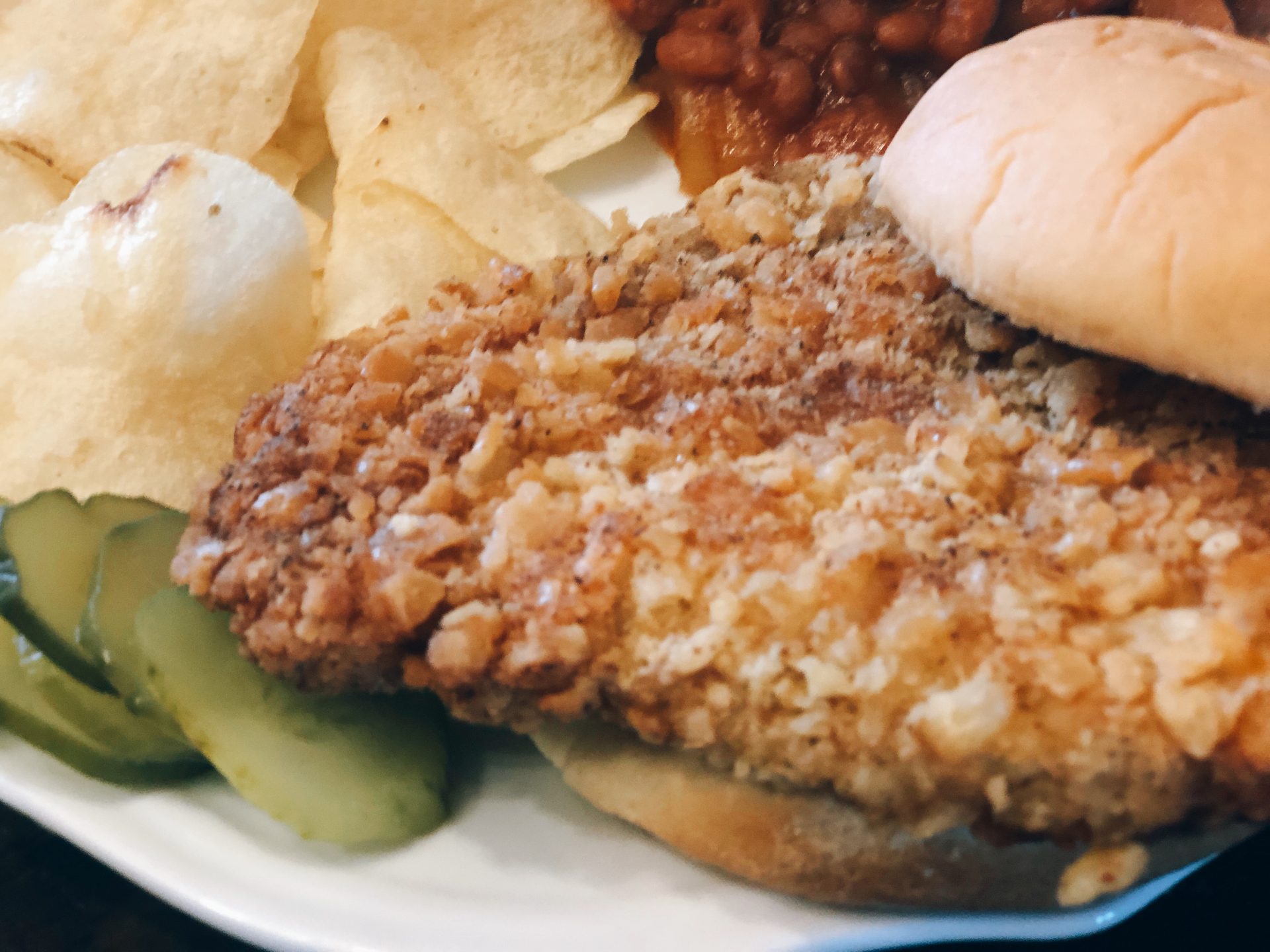 Breaded Pork Tenderloin from Farmwife Feeds is a crispy juicy classic sandwich with a cracker breading. #pork #sandwich #tenderloin
