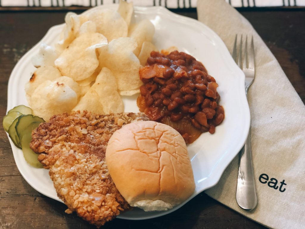 Breaded Pork Tenderloin from Farmwife Feeds is a crispy juicy classic sandwich with a cracker breading. #pork #sandwich #tenderloin