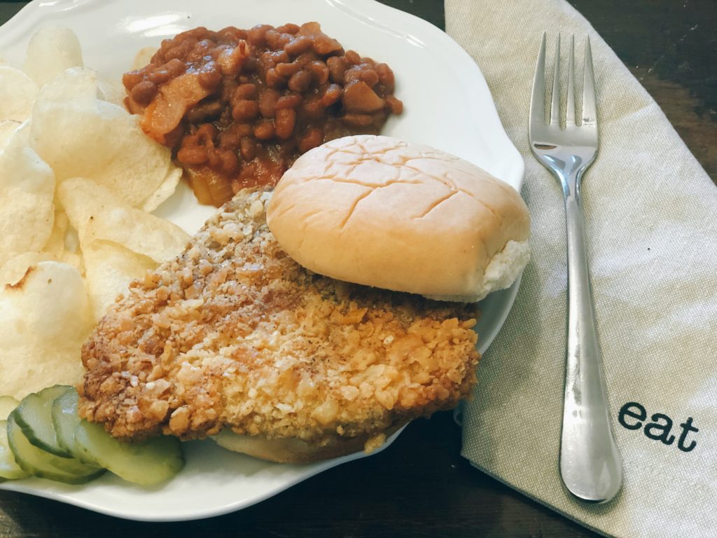 Breaded Pork Tenderloin from Farmwife Feeds is a crispy juicy classic sandwich with a cracker breading. #pork #sandwich #tenderloin