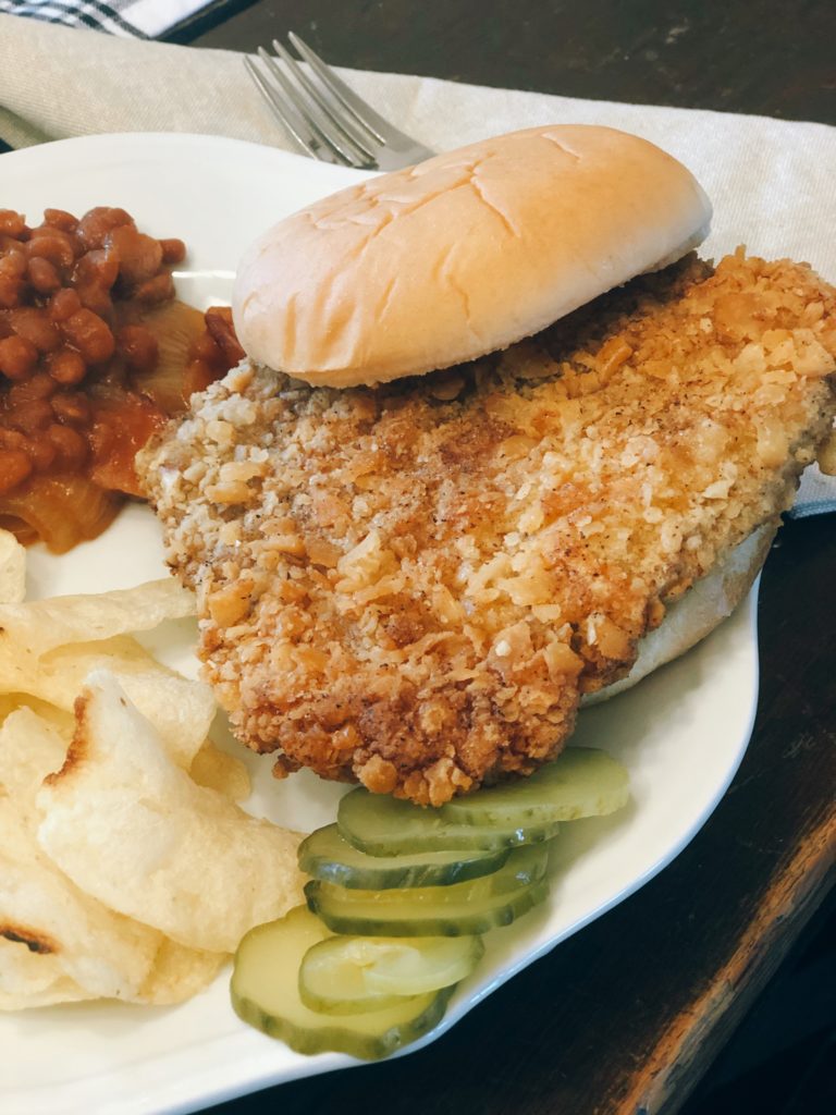 Breaded Pork Tenderloin from Farmwife Feeds is a crispy juicy classic sandwich with a cracker breading. #pork #sandwich #tenderloin