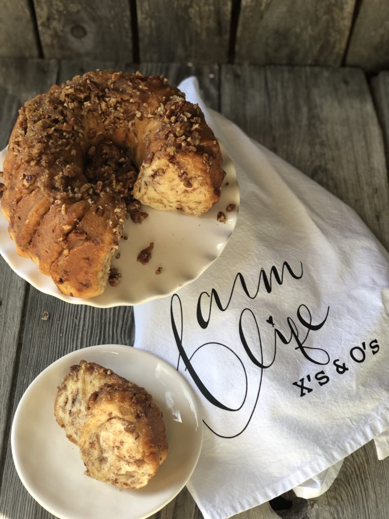 Easy Caramel Cinnamon Roll Bundt Cake from Farmwife Feeds makes a pop can of cinnamon rolls into a delicious easy bundt cake with a caramel glaze and pecans. #cinnamonrolls #bundtcake #easybreakfast