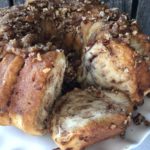 Easy Caramel Cinnamon Roll Bundt Cake from Farmwife Feeds makes a pop can of cinnamon rolls into a delicious easy bundt cake with a caramel glaze and pecans. #cinnamonrolls #bundtcake #easybreakfast