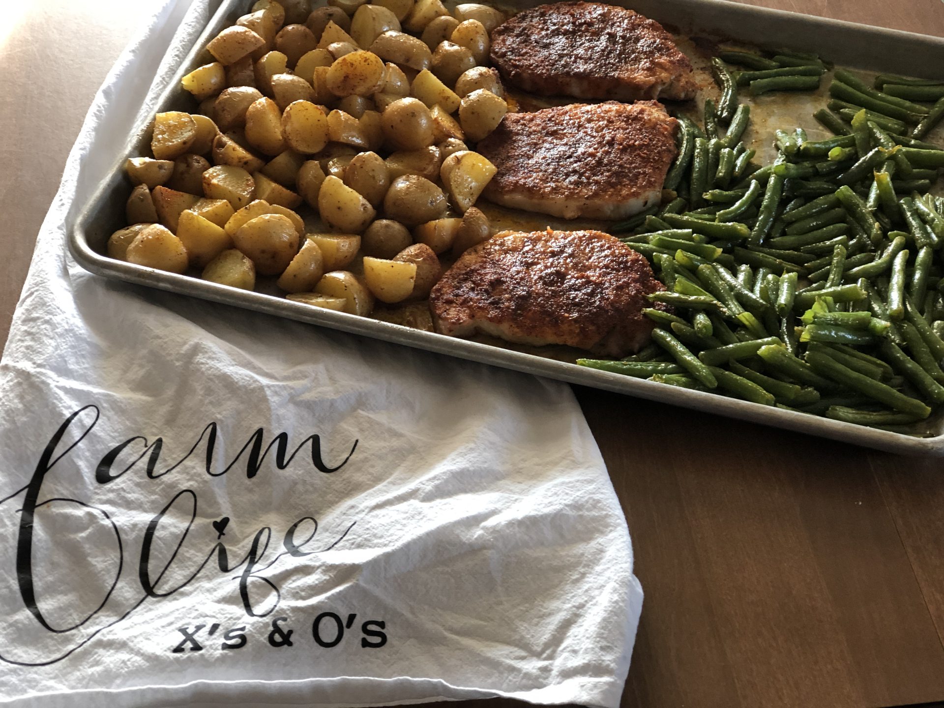Sheet Pan Pork Chop Dinner from Farmwife Feeds is a one pan, 5 minute prep meal to feed the whole family. #pork #onepan #sheetpandinner