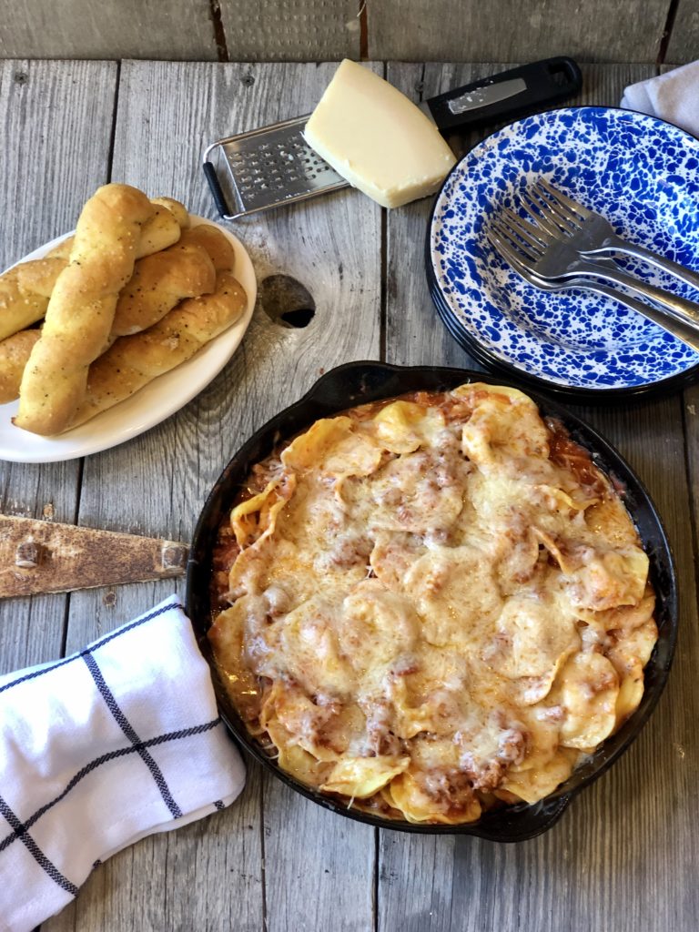 Easy Ravioli Casserole from Farmwife Feeds is a hearty meal that is ready in less than 30 minutes or can be prepped ahead for busy nights.