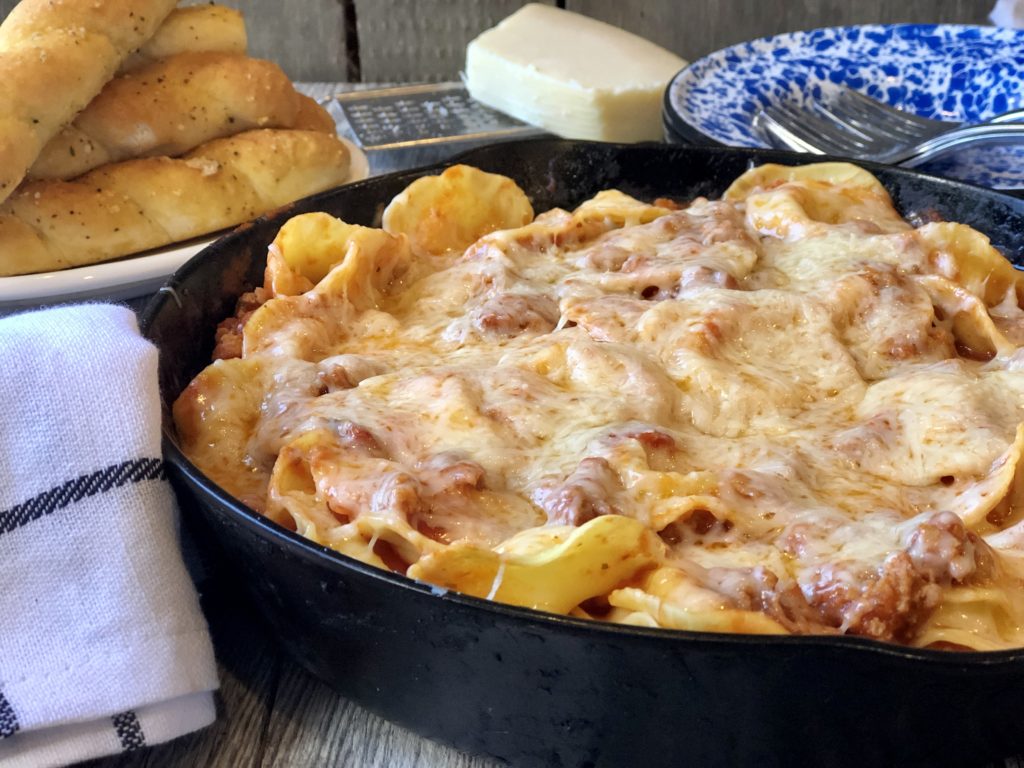 Easy Ravioli Casserole from Farmwife Feeds is a hearty meal that is ready in less than 30 minutes or can be prepped ahead for busy nights.